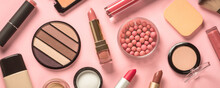 Make Up Products At Pink Background. Eye Shadow, Powder, Cream, Lipstick And More For Professional Make Up. Long Banner Format.