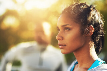 Poster - focused on staying in form. shot of a young sporty couple out for a workout.
