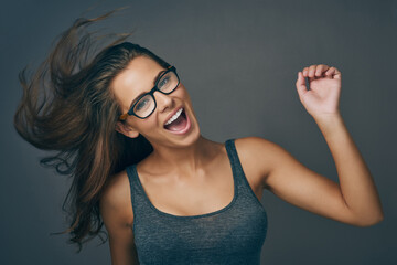 Poster - Let go and be who you are. Studio shot of an attractive young woman wearing glasses.