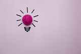 Fototapeta Nowy Jork - Creative thinking ideas and innovation concept. A ball of pink threads with a light bulb symbol on a violet background