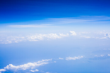 Wall Mural - top view from fly, aerial view of clouds in blue sky
