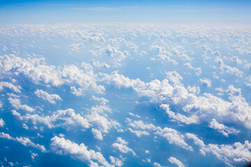 Wall Mural - top view from fly, aerial view of clouds in blue sky