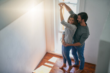 Wall Mural - May I have this dance. Shot of an affectionate young couple getting ready to dance.