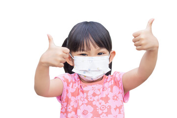 Wall Mural - Portrait image of 4-5 yeas old baby. Happy Asian child girl smiling and wearing face mask,​ She showing the thumb up fingers. On white background isolated.