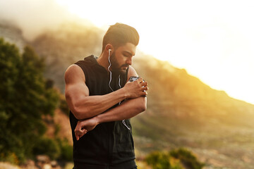 Poster - The right track can change everything. Shot of a young man exercising outdoors.