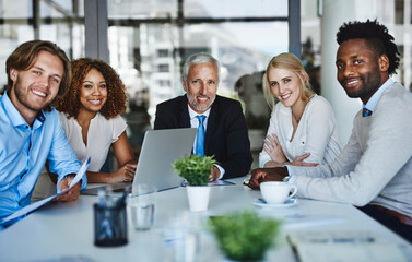 Aufkleber - teamwork makes their meetings work. portrait of a team of professionals having a meeting in the boar