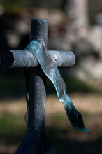 A Cross With A Tie In Graveyard