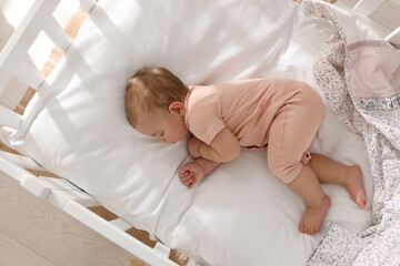 Wall Mural - Cute little baby sleeping in soft crib at home, top view