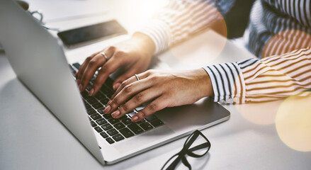 Poster - Make the connection to grow your business. Closeup shot of an unrecognizable businesswoman working on a laptop in an office.