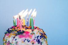 Birthday Cake With Candles On A Colorful Background