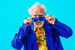 © oneinchpunch - Cool senior man with fashionable outfit portrait - Funny old male person with cool and playful attitude on colorful background