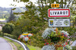 Close-up sign of entrance to the town of Livarot known for its cheese.