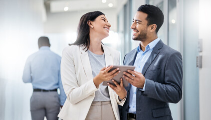 Poster - They dont just survive under pressure, they thrive. Shot of two businesspeople discussing something on a digital tablet.