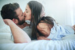© Adene Sanchez/peopleimages.com - I cant think of a more perfect morning. Shot of a loving couple sharing a kiss in bed.