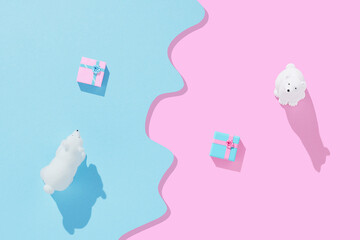 Wall Mural - Polar bears toys with Christmas gifts boxes on bright pastel blue and pink background. Christmas and winter holidays concept.