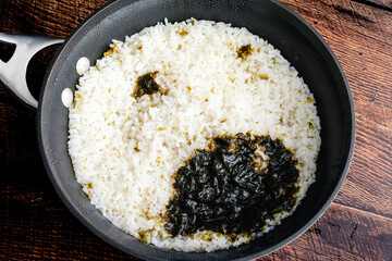 Sticker - Sushi Rice that has Been Cooked with a Nori Sheet: Fresh sushi rice in a saucepan that has been cooked with a piece of seaweed