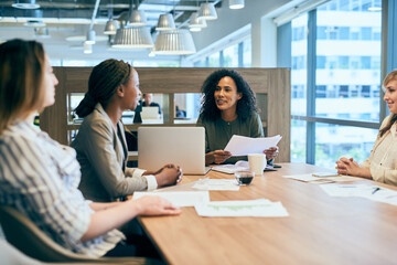 Poster - What ideas do you have for us. Shot of a group of confident young businesspeople having a meeting in the office at work during the day.