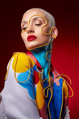 I dont want attention, I get it without asking. Studio shot of a stylish young woman posing against a red background.