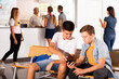 © JackF - School Boys using phones, have rest between lessons at hallway in school