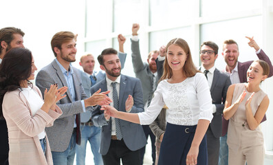 Wall Mural - happy young employees greeting their young colleague