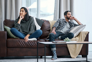 Sticker - The silent treatment isnt the solution. Shot of a young couple sitting on the sofa and ignoring each other.