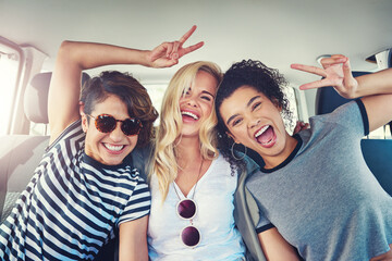 Canvas Print - Our road trips are always fun. Shot of girlfriends out on a road trip together.