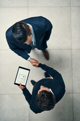 Aufkleber - Partnering together on a new project. High angle shot of two businessmen shaking hands in an office.