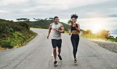 Poster - Clocking some workout time in the fresh air. Shot of a sporty young couple exercising together outdoors.