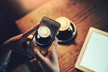 Poster - You cant buy happiness, but you can buy coffee. Shot of an unidentifiable young woman using wireless technology in a coffee shop.