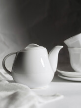 Minimalistic White Porcelain Teapot And Cups For Tea Drinking For Two