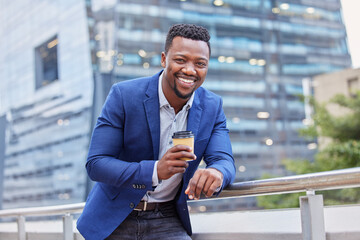 Canvas Print - Just the boost I needed. Shot of a young businessman drinking a cup of coffee against a city background.