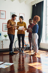 Poster - Working together brings out the best in them. Shot of a group of creative workers having a brainstorming session in an office.