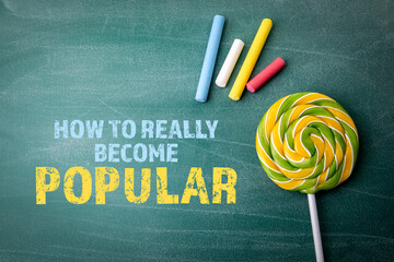 Wall Mural - How To Really Become Popular. Colored pieces of chalk and candy on a green board