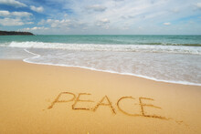 Peace Word On Sea Sandy Shore.