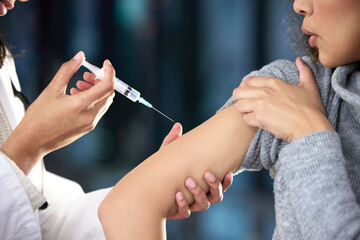 Poster - Itll only hurt for a few seconds. Shot of a woman receiving an injection at a Covid-19 vaccination centre.