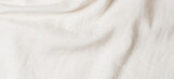 White crumpled linen fabric texture background. Natural linen organic eco textiles canvas background. Top view