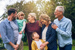 © Tamani Chithambo/peopleimages.com - Think our hands are full, you should see our heart. Shot of a multigenerational family outside.