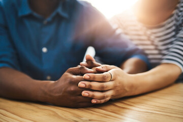 Aufkleber - Put love first. Cropped shot of an unidentifiable man and woman holding hands on a table.