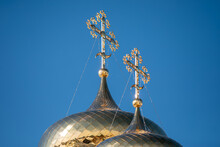 Golden Domes With Crosses Of The Orthodox Church Glow In Close-up On The Blue Sky