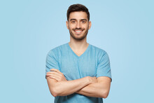 Young Handsome Man Wearing Blue Tshirt, Standing With Crossed Arms