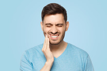 Man Touching His Face And Closing Eyes With Expression Of Horrible Suffer From Aching Tooth