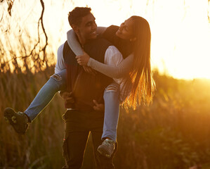 Poster - Youve become so strong lately. Shot of a young man giving his girlfriend a piggyback ride.