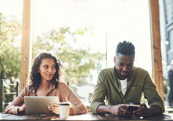 Poster - I wonder if hes single.... Shot of two young people using their wireless devices in a coffee shop.