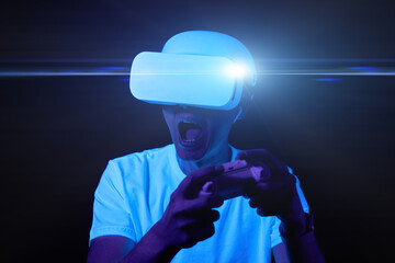 Wall Mural - man with virtual reality headset is playing game.