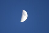 Fototapeta Na sufit - Half moon on a blue sky