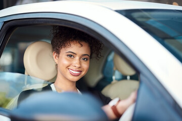 Sticker - Feels good being on this side of the car. Cropped portrait of an attractive young businesswoman smiling while driving her new car.