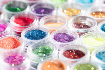 Poster - jars with colored sequins lie in rows