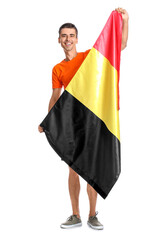 Canvas Print - Young man with flag of Belgium on white background