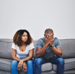 Poster - Have the walls closed in on their relationship. Shot of a young couple having relationship problems at home.