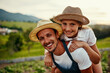 © Lyndon Stratford/peopleimages.com - Working on the farm can be an adventure. Cropped portrait of a handsome man piggybacking his young daughter while working on their farm.
